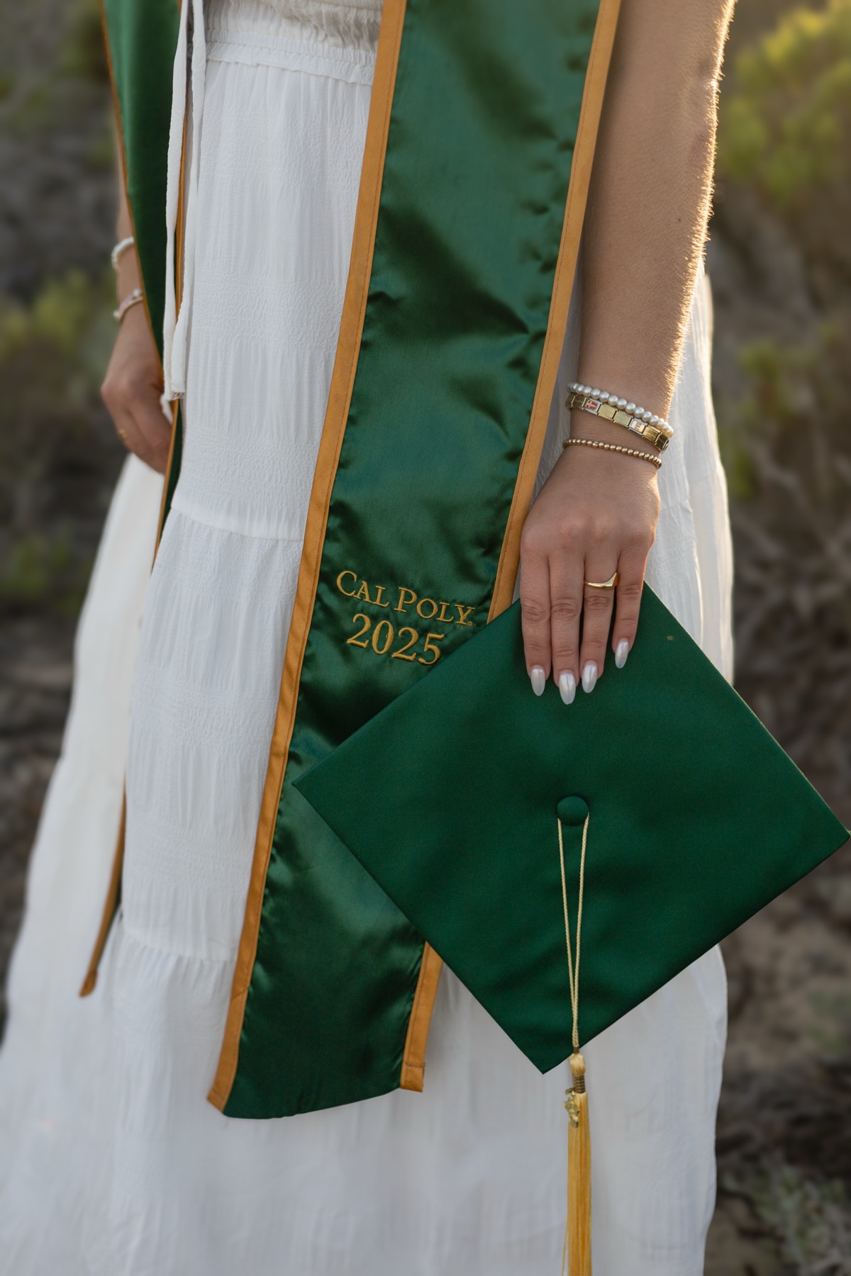 Close-up of a Cal Poly 2025 stole and cap
